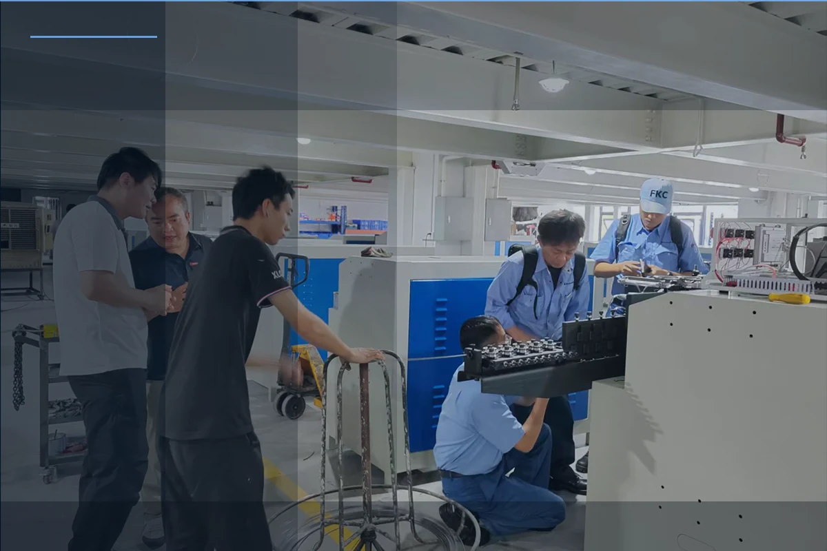 Customer and engineers observing machine trial production